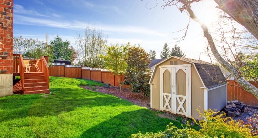 Fenced backyard with storage shed in Tyler